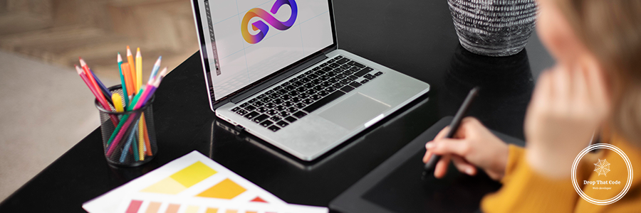 female-logo-designer-working-her-tablet-connected-laptop female-logo-designer-working-her-tablet-connected-laptop