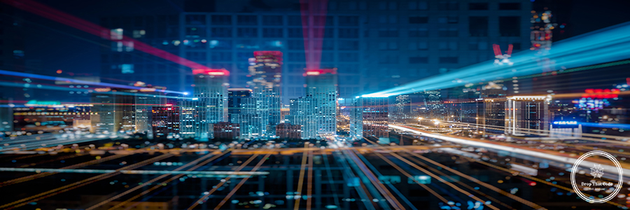 Light trails above buildings at night in China.