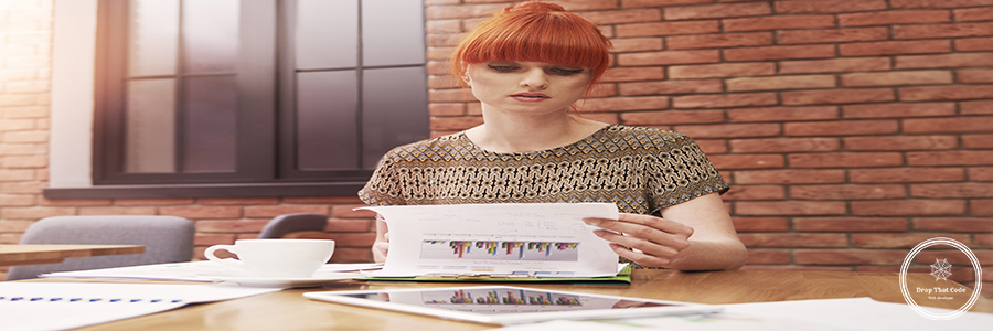 Ginger woman with stack of business documents Ginger woman with stack of business documents