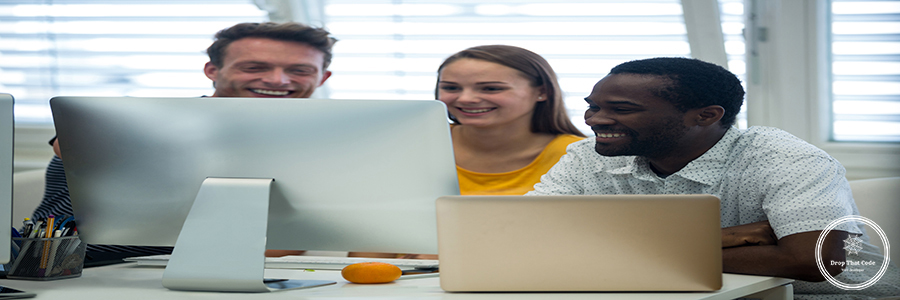 Male and female graphic designers interacting with each other Male and female graphic designers interacting with each other in office