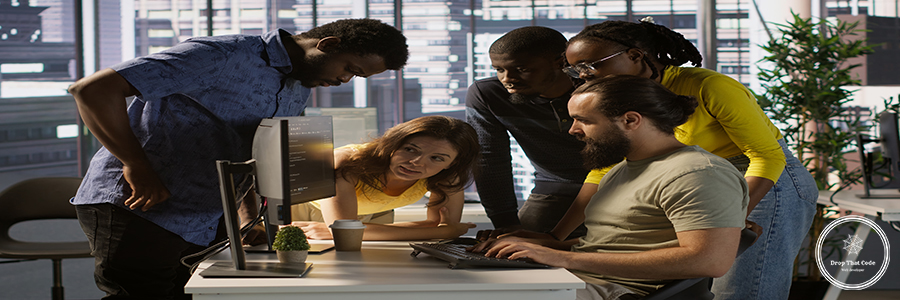 Team of developers doing brainstorming, optimizing code Programmers gathered together to conduct code review to fix errors, identifying technical issues with company software. Team of developers doing brainstorming, optimizing code, camera A