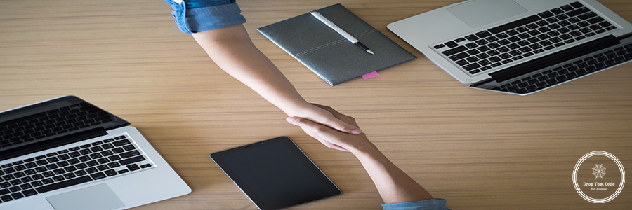 Two Businesspeople shaking hands indoors Two Businesspeople shaking hands indoors.
