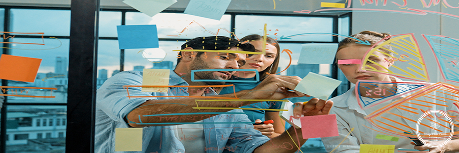 Group of business team working together, discussing at glass wall. Tracery Group of happy professional business team working together, discussing and writing at sticky notes about marketing idea, plan, strategy at glass wall with graph and colorful sticky notes. Tracery
